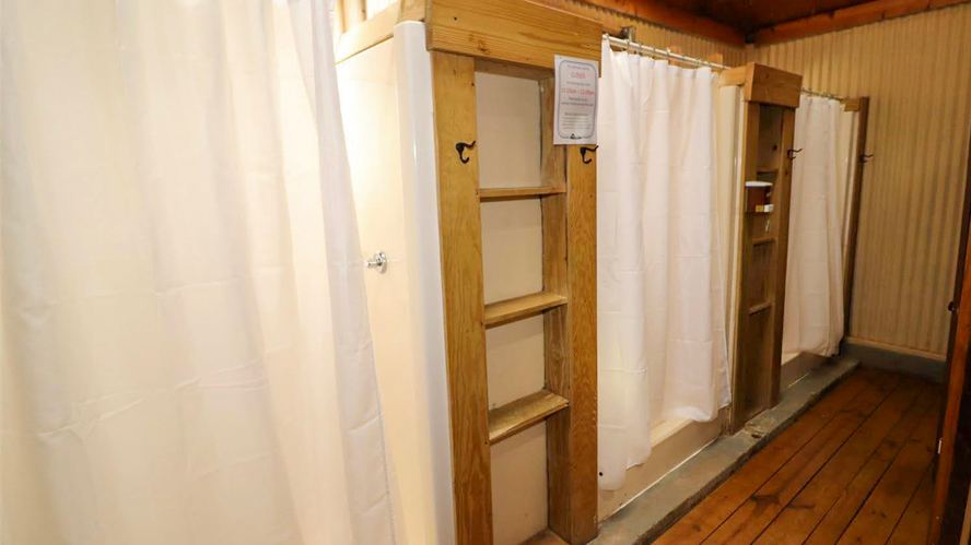 Lower bathhouse features private shower stalls