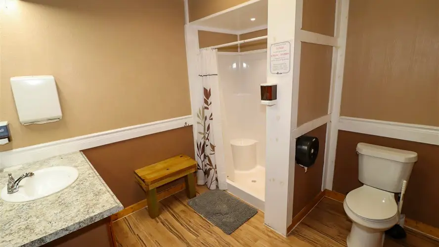 Private bathroom with shower. Door is lockable with clean out hook-ups. This bathroom is located on the backside of the main bathhouse